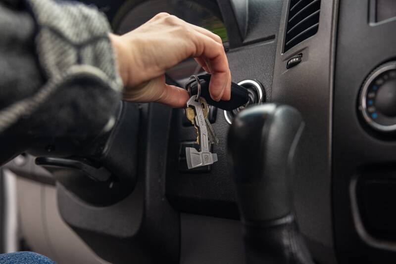 Hatchet Keychain on keys used to turn a car on