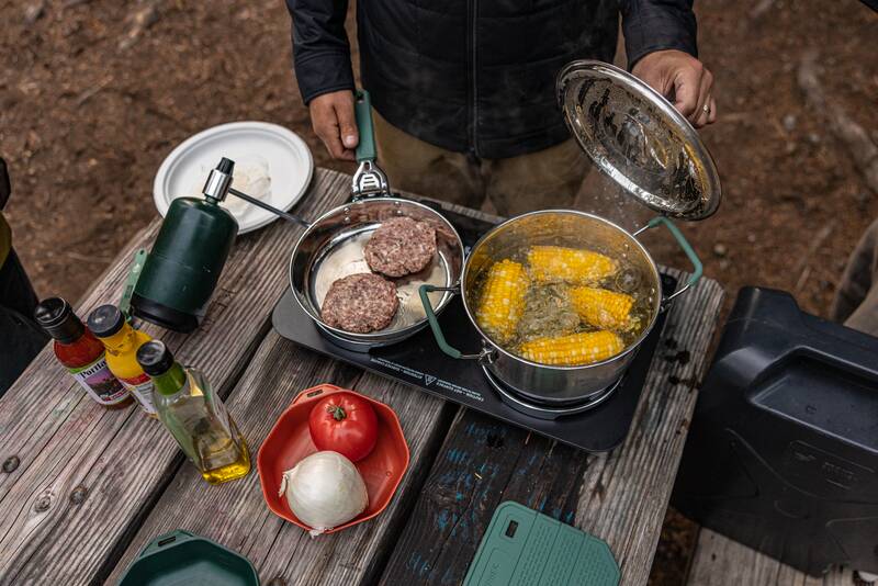 Compleat Collection with corn and burgers cooking