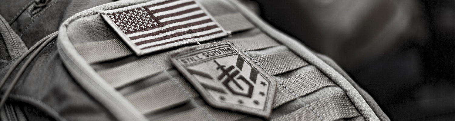 Molle pouch with American flag and tactical patch on a dark background
