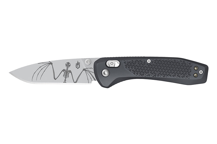 Folding knife with a black handle and silver blade on a white background